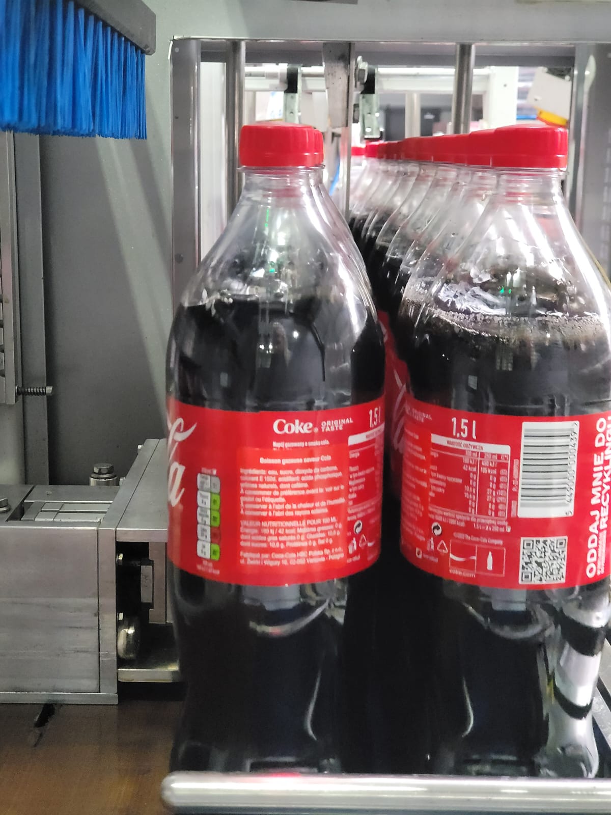 1.5L bottles Polish Coca Cola during machine pacing